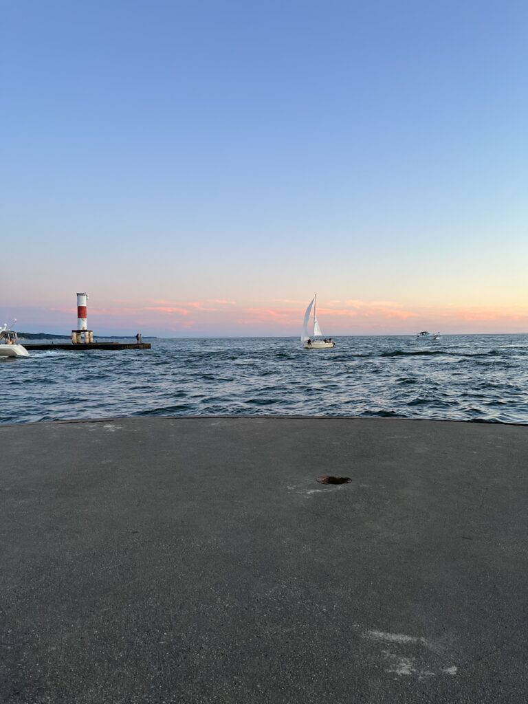 Holland Lakeshore with Sailboat and Lighthouse Lake Michigan